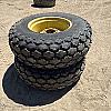 Pair of 16.9 24 turf tires on Jd 8 bolt wheels