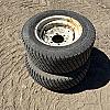 Pair of 27x10:50-15 turf tires on Newholland 6 bolt wheels