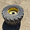 Pair of 300/70R16.5 tires on Jd 6 bolt wheels