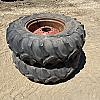 Pair of 14.9 24 tires on case 8 bolt wheels