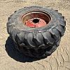Pair of 14.9 24 tires on case 8 bolt wheels