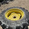Pair of unused Firestone 420/85R34 tires on Jd 8 bolt wheels