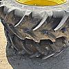 Pair of unused Firestone 420/85R34 tires on Jd 8 bolt wheels