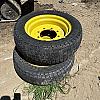 Pair of 12Ll-16 turf tires on John Deere 8 bolt wheels