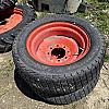 Pair of 12L -16 turf tires on Kubota 8 bolt wheels