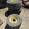 Set of 4 turf tires on rim from John Deere 4700 compact