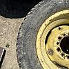 Set of 4 turf tires on rim from John Deere 4700 compact