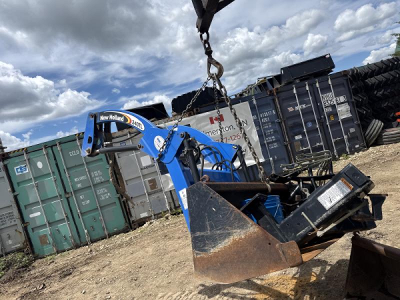 2012 New Holland 240TL loader with bucket brackets and valve