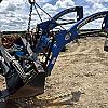 2012 New Holland 240TL loader with bucket brackets and valve