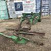 2012 John Deere loader with brackets and a valve
